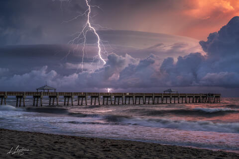 Captured at Juno Beach Pier in Florida, “Pier Insanity” freezes a surreal moment just before sunrise when lightning exploded through storm clouds over the Atlan