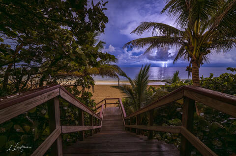 Beach stairway with lightning over the ocean, Juno Beach.