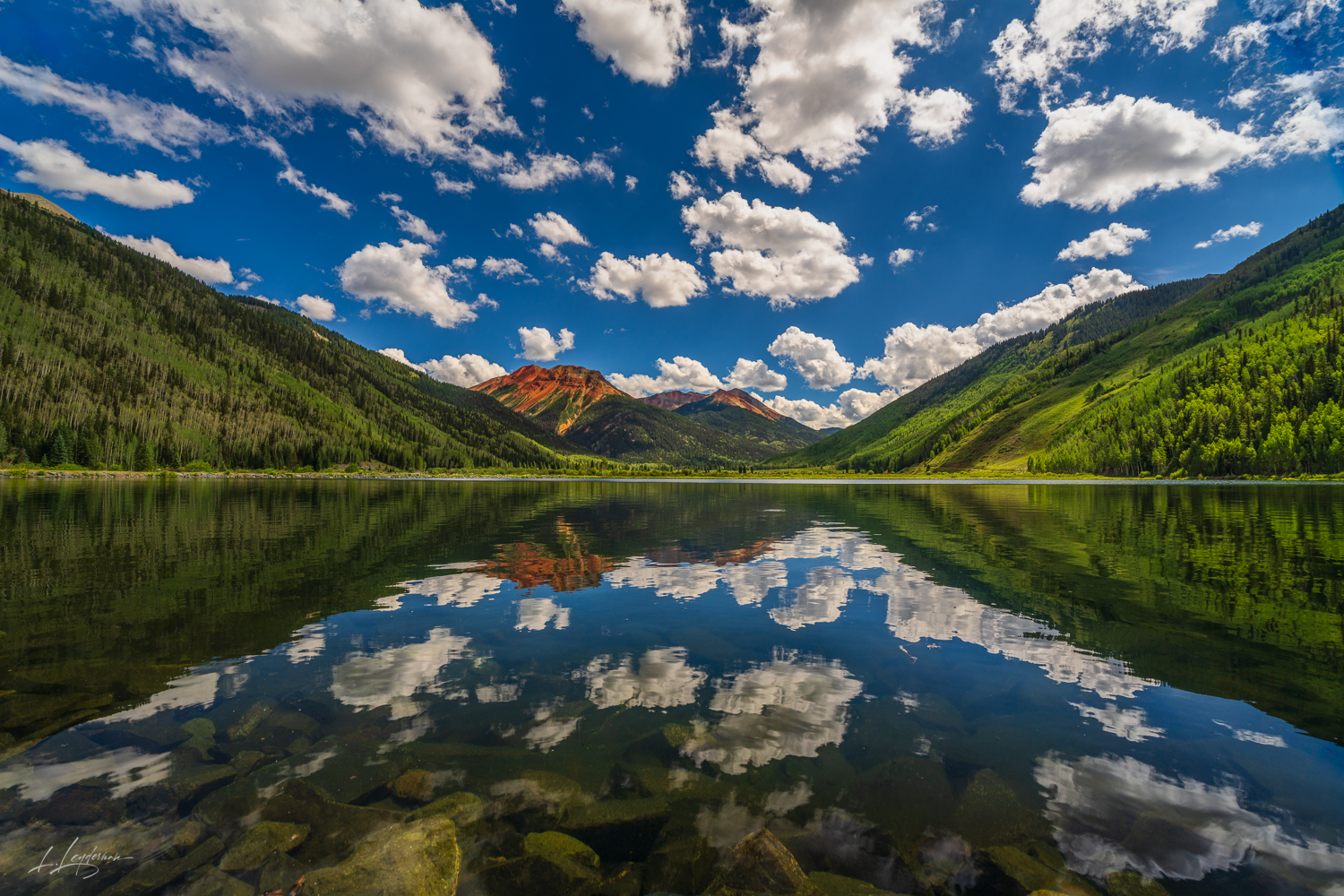 Enchanting Colorado: A Mesmerizing View of Red Mountains, Clouds, Aspens and Pines Reflected in a Crystal Clear Lake